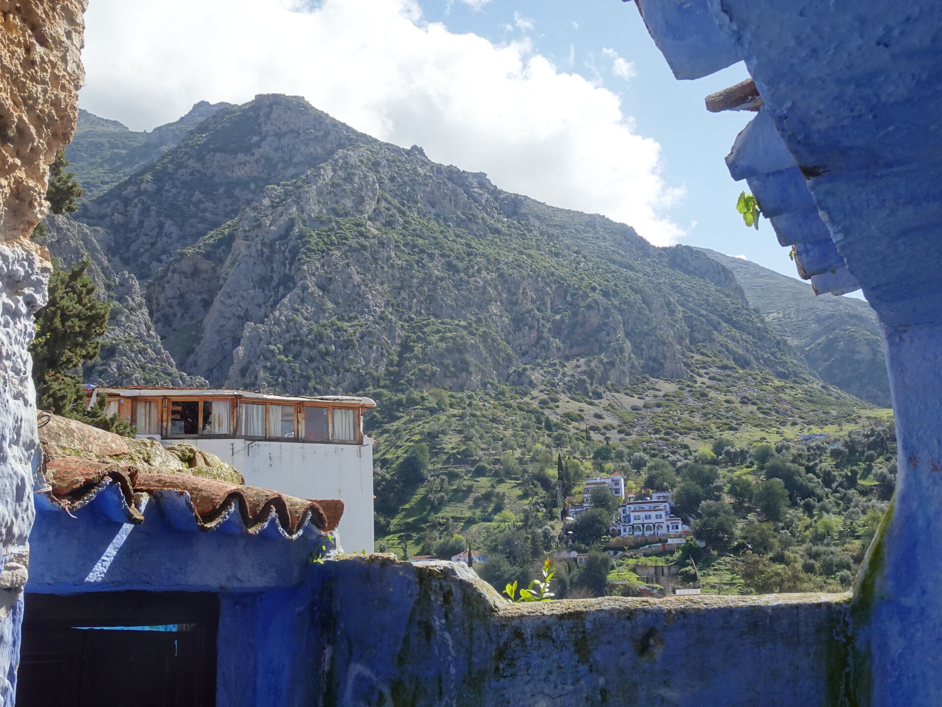 Rocky mountain framed between blue-washed walls