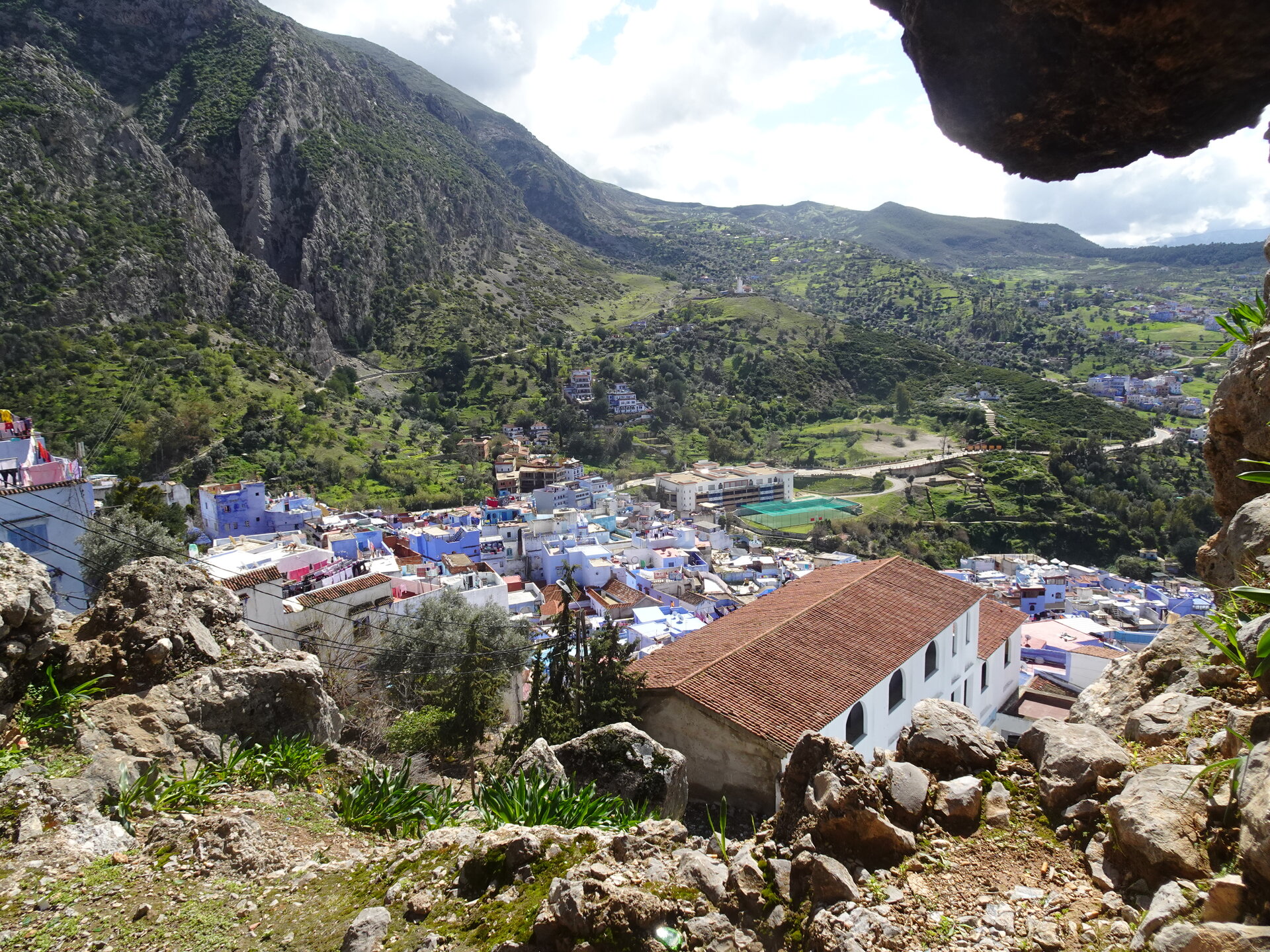 Blue rooftops of Chefchaouen seen from the hillside above
