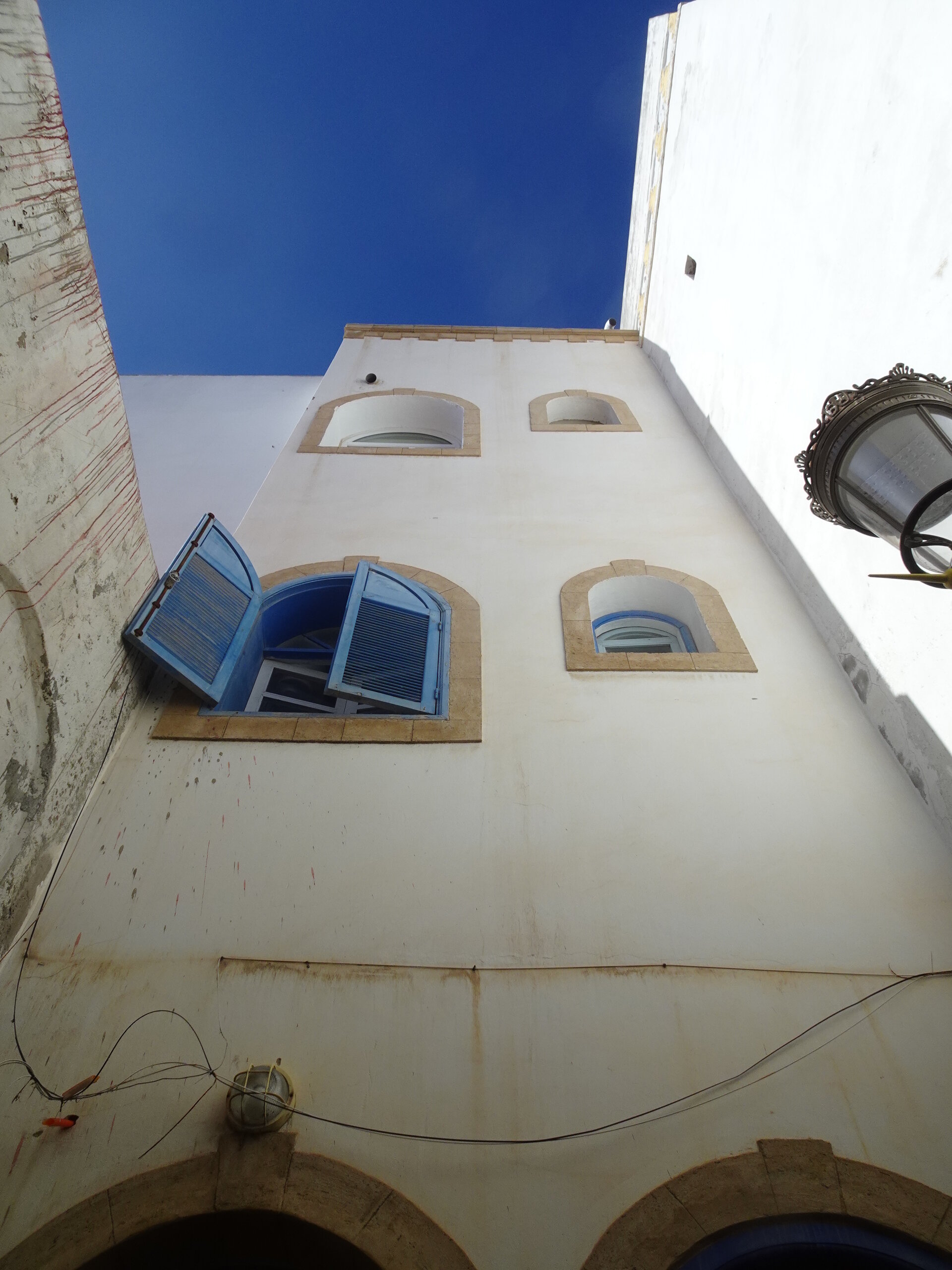 Windows with blue shutters