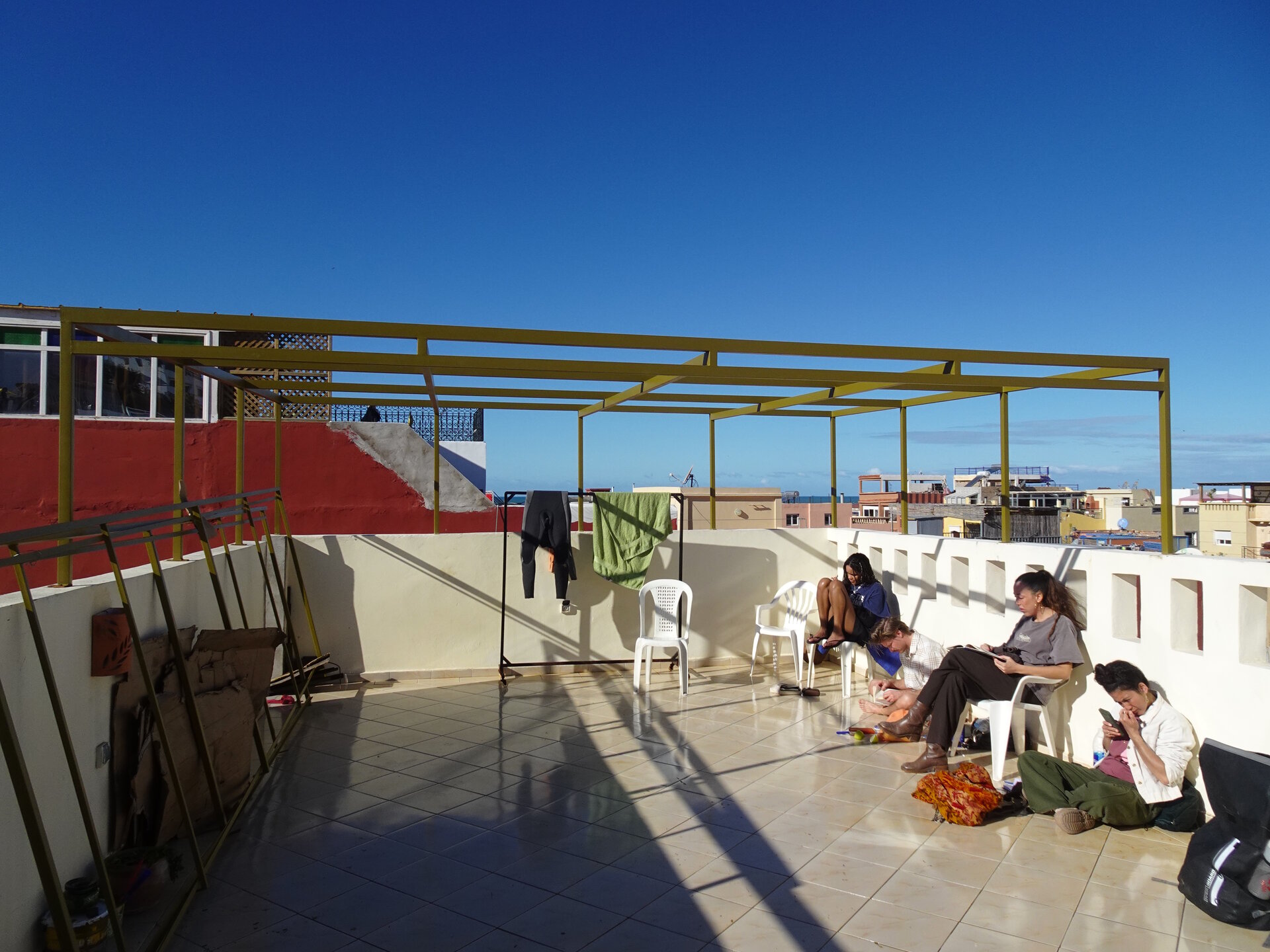 People reading on hostel roof